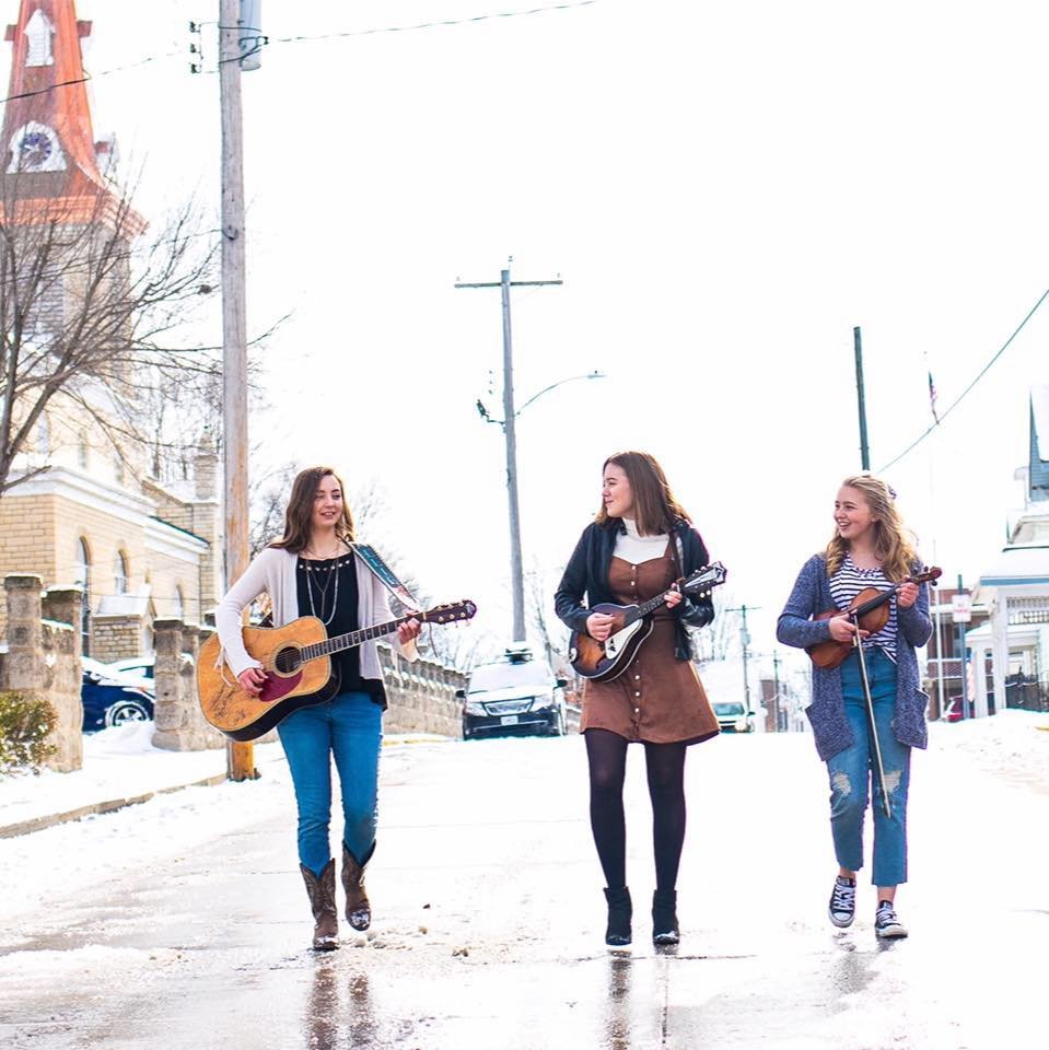 The Osage Angels carry their music with them down Main Street past St. Joseph Church in Westphalia.